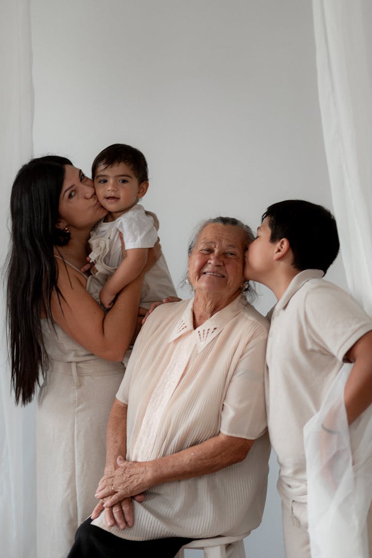 Heartwarming moment of three generations celebrating together indoors.